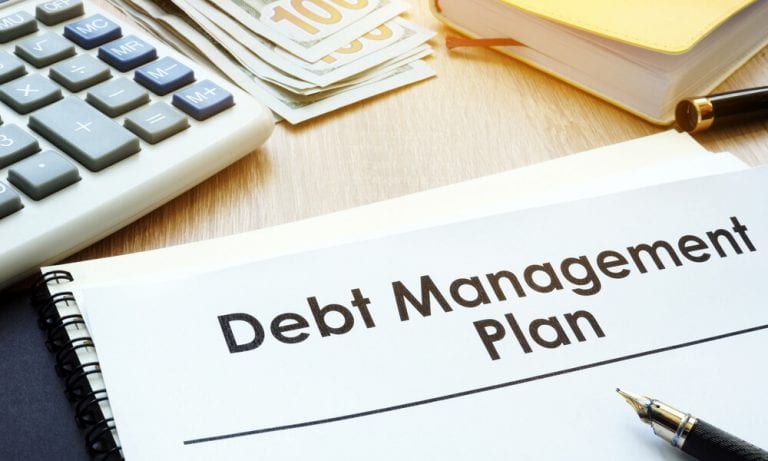 Debt Management Plan written on notepad